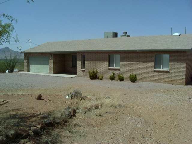 176 Camino Oceano Rio Rico, AZ 85648 - Photo 1 of 8 a view of a house with a yard