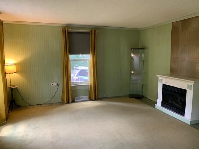 129 Trouttown Road Hunker, PA 15639 - Photo 19 of 25 Living room with fireplace.