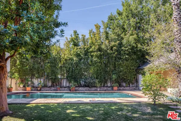 a view of a fountain in front of a house