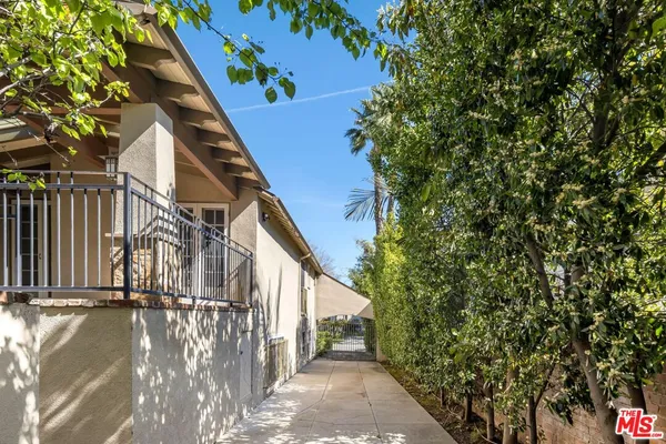 a view of a house with a tree
