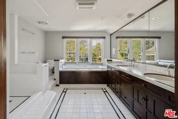 a kitchen with a sink and large window