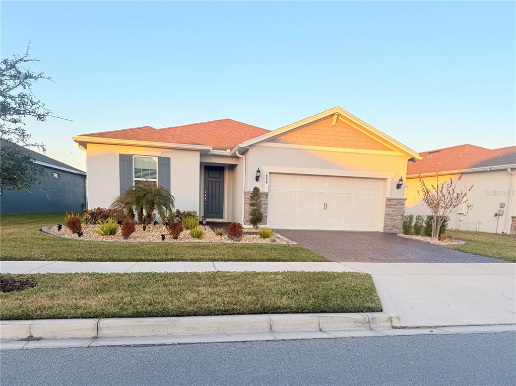 1994 Spring Shower Circle Kissimmee, FL 34744 - Photo 1 of 29 a front view of a house with a yard