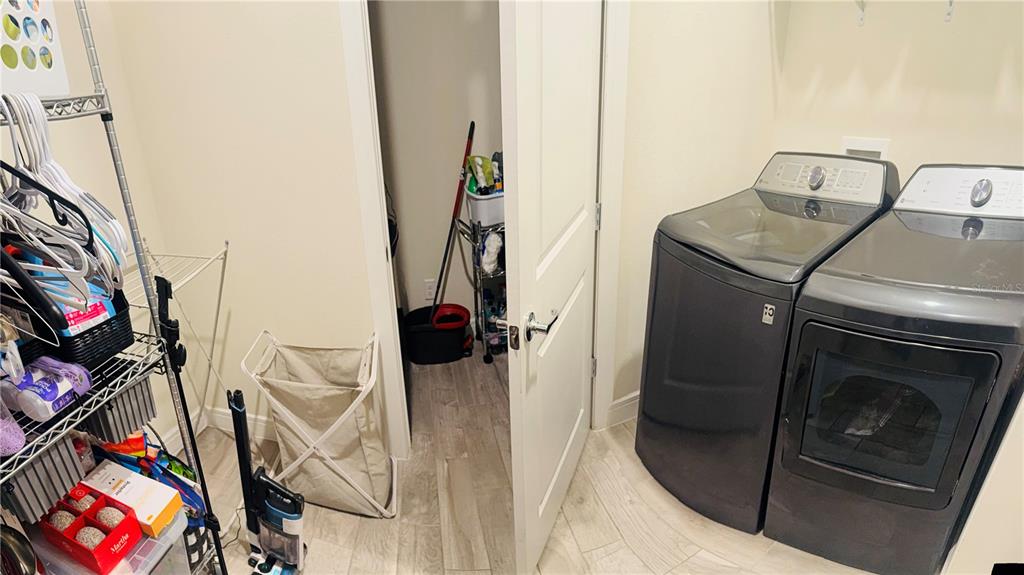 1994 Spring Shower Circle Kissimmee, FL 34744 - Photo 11 of 29 a utility room with dryer washer and stair