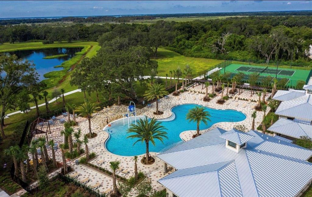 1994 Spring Shower Circle Kissimmee, FL 34744 - Photo 25 of 29 a view of a chairs and table in patio with a lake view