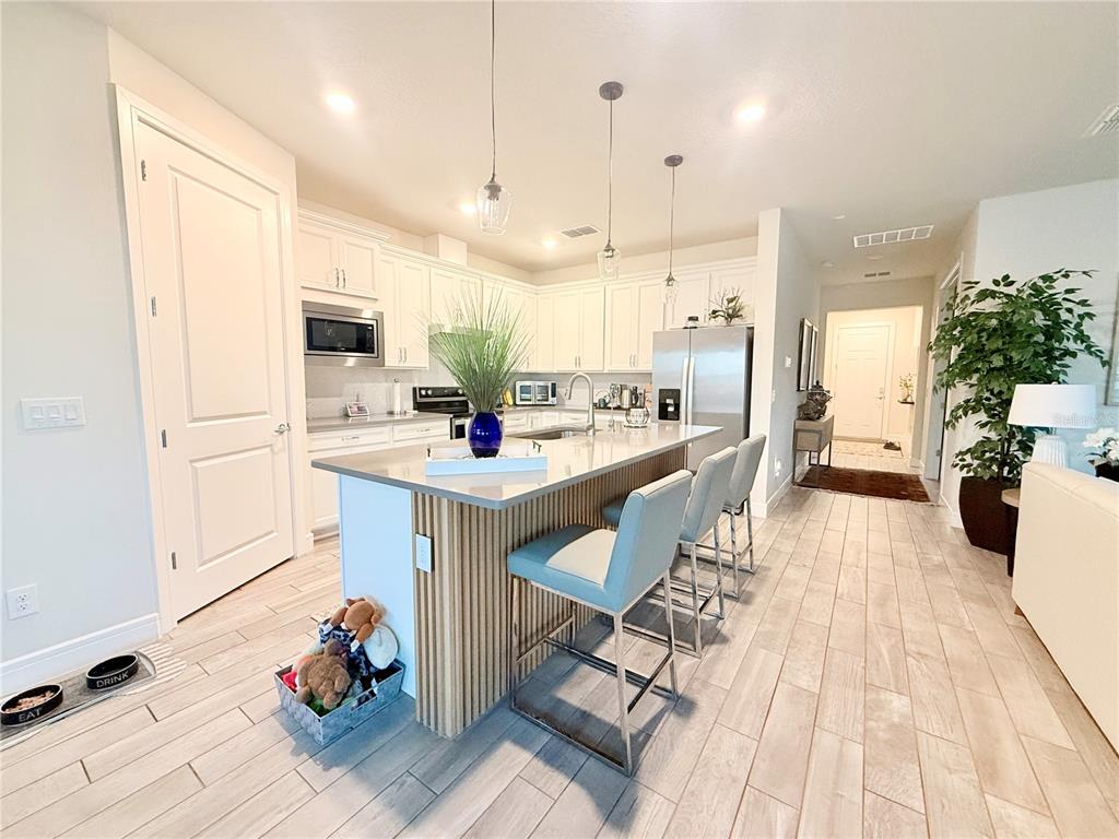 1994 Spring Shower Circle Kissimmee, FL 34744 - Photo 3 of 29 a large kitchen with a large counter top appliances and cabinets