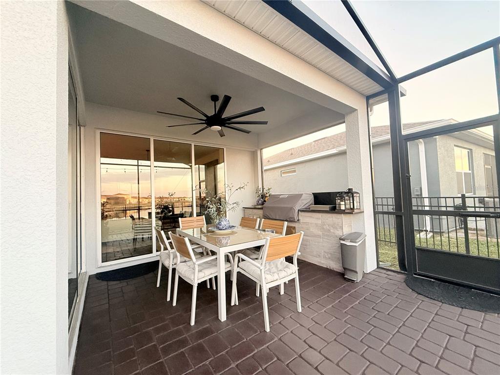 1994 Spring Shower Circle Kissimmee, FL 34744 - Photo 6 of 29 a dining room with furniture a chandelier and window