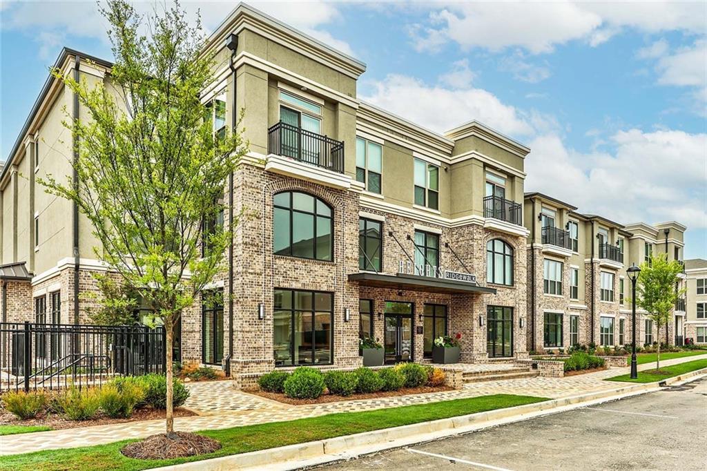 1003 Ridgewalk Parkway, Unit 4316 Woodstock, GA 30189 - Photo 24 of 38 a front view of a multi story residential apartment building
