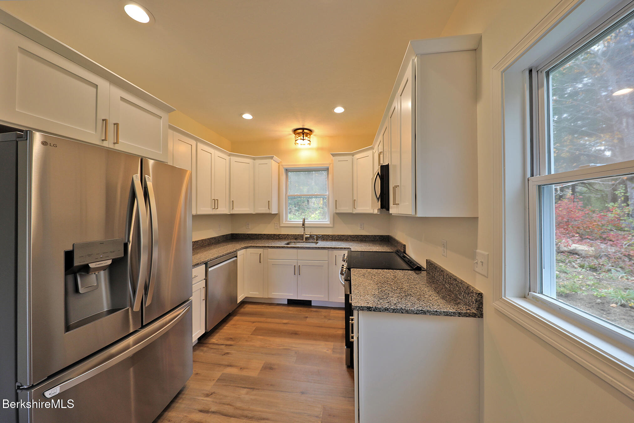 165 Sandisfield Road Sandisfield, MA 01255 - Photo 11 of 49 a kitchen with a refrigerator sink and stove