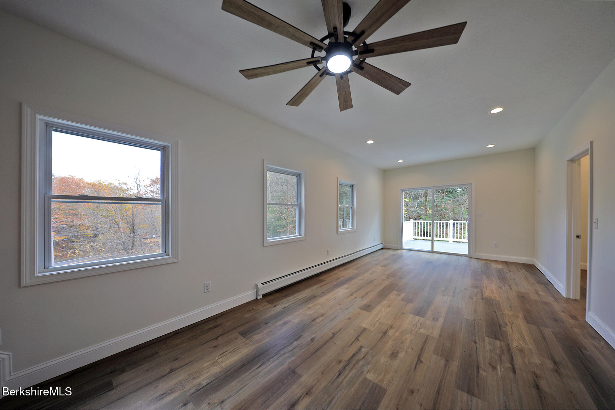165 Sandisfield Road Sandisfield, MA 01255 - Photo 14 of 49 a view of an empty room with wooden floor and a window