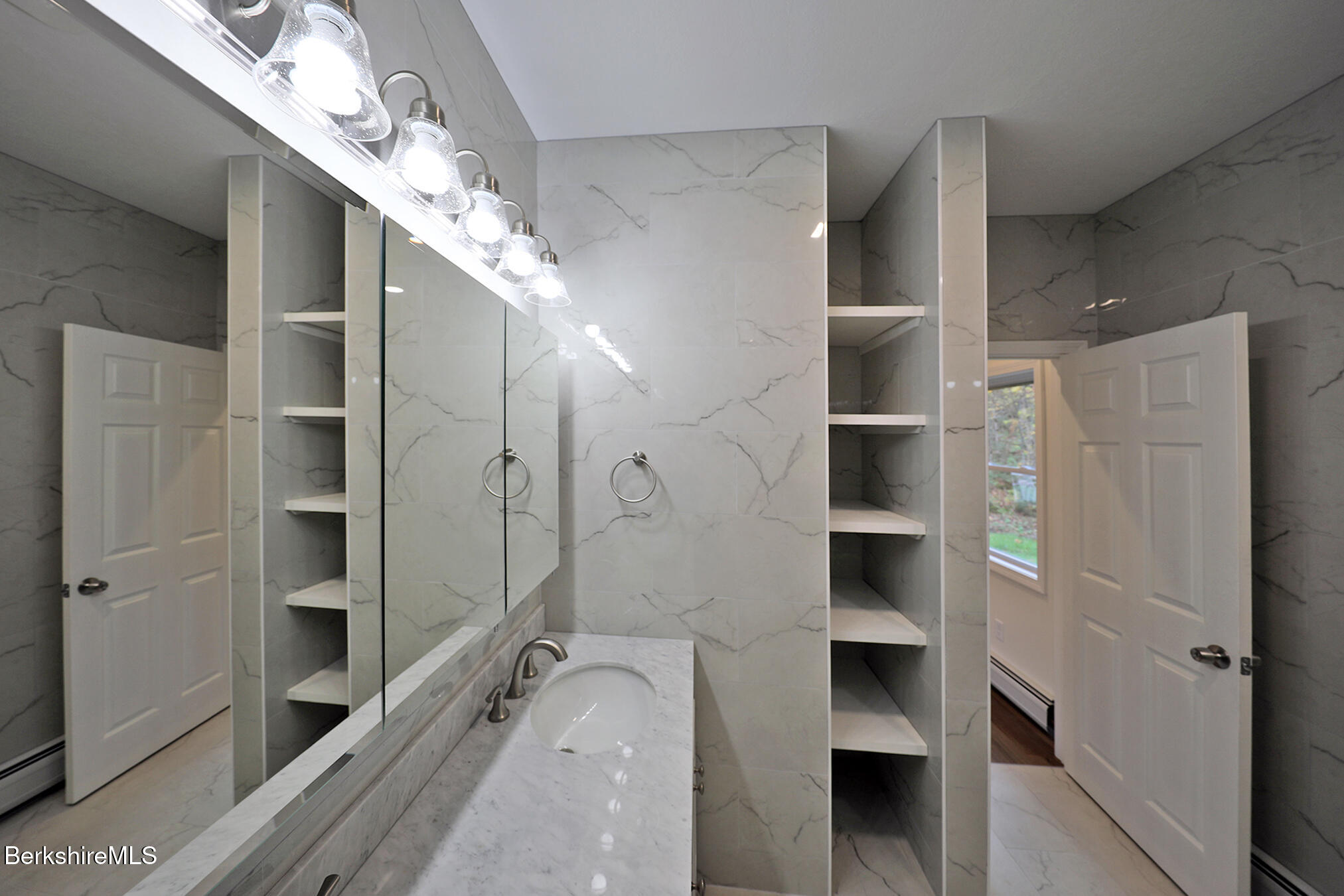 165 Sandisfield Road Sandisfield, MA 01255 - Photo 20 of 49 a bathroom with a double vanity sink and a shower