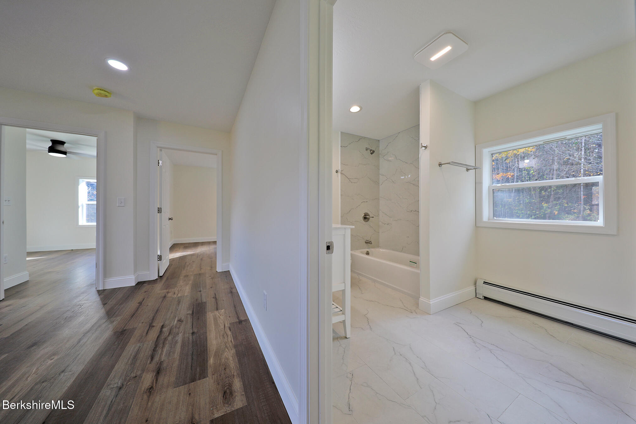165 Sandisfield Road Sandisfield, MA 01255 - Photo 29 of 49 a view of a hallway with wooden floor and cabinet