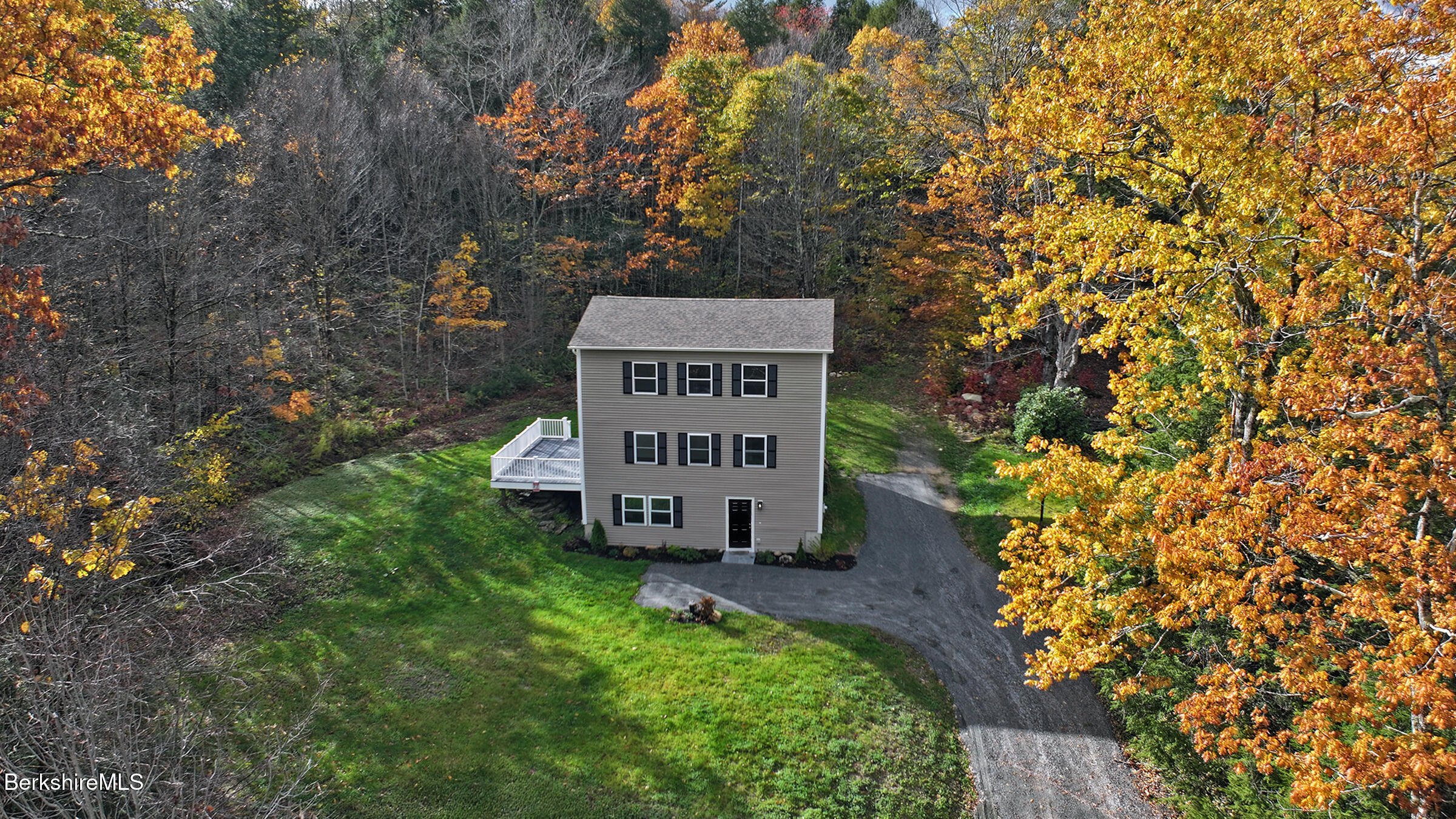 165 Sandisfield Road Sandisfield, MA 01255 - Photo 4 of 49 a sign on the side of the road