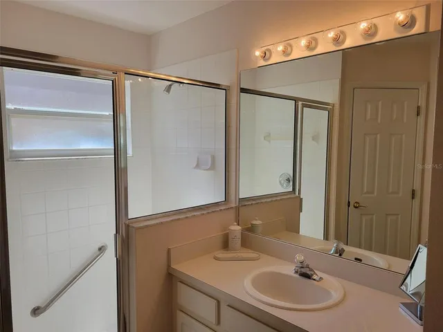 a bathroom with a sink and a mirror