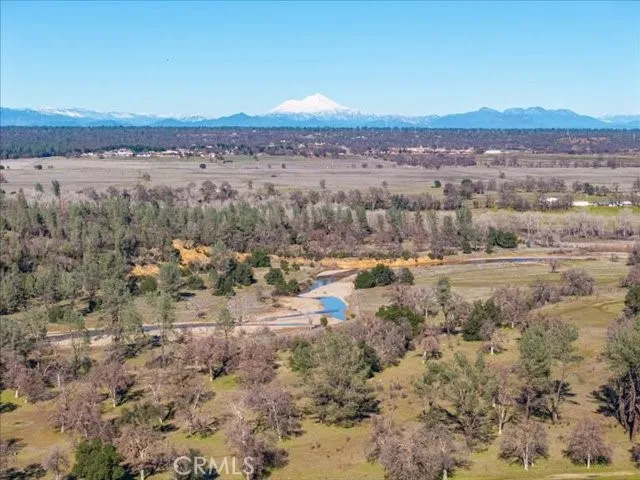a view of a yard with snow on the road