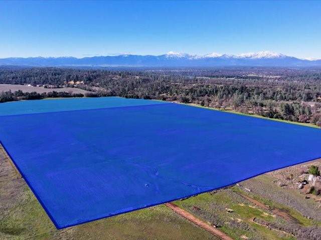 0 Old Gold Road Cottonwood, CA 96022 - Photo 4 of 53 a view of a red yard with a lake