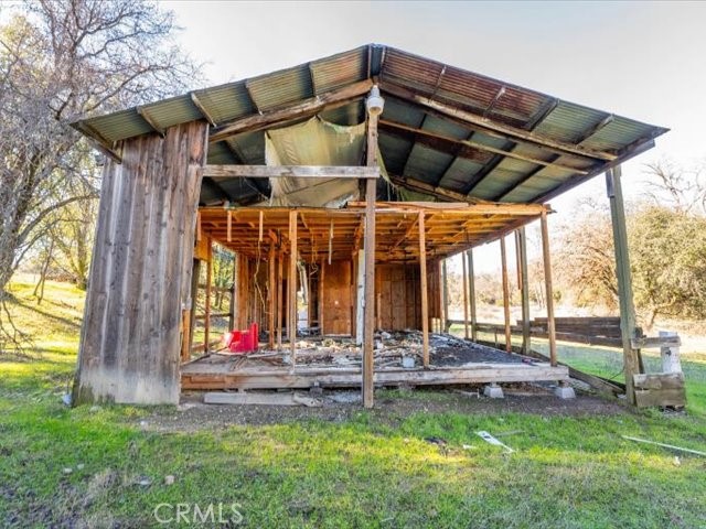 0 Old Gold Road Cottonwood, CA 96022 - Photo 43 of 53 a view of a backyard with table and chairs under an umbrella