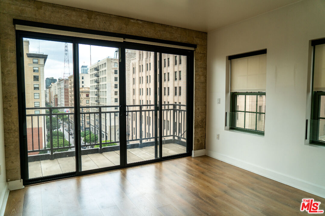 416 South Spring Street, Unit 906 Los Angeles, CA 90013 - Photo 11 of 18 a view of a large window with wooden floor