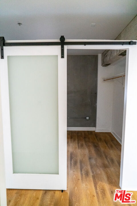 416 South Spring Street, Unit 906 Los Angeles, CA 90013 - Photo 13 of 18 a view of walk in closet with clothes