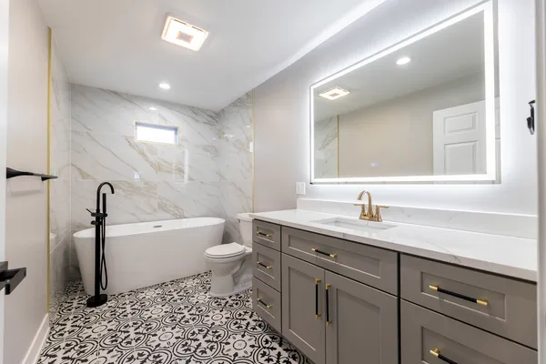 a bathroom with a sink a toilet and a bathtub