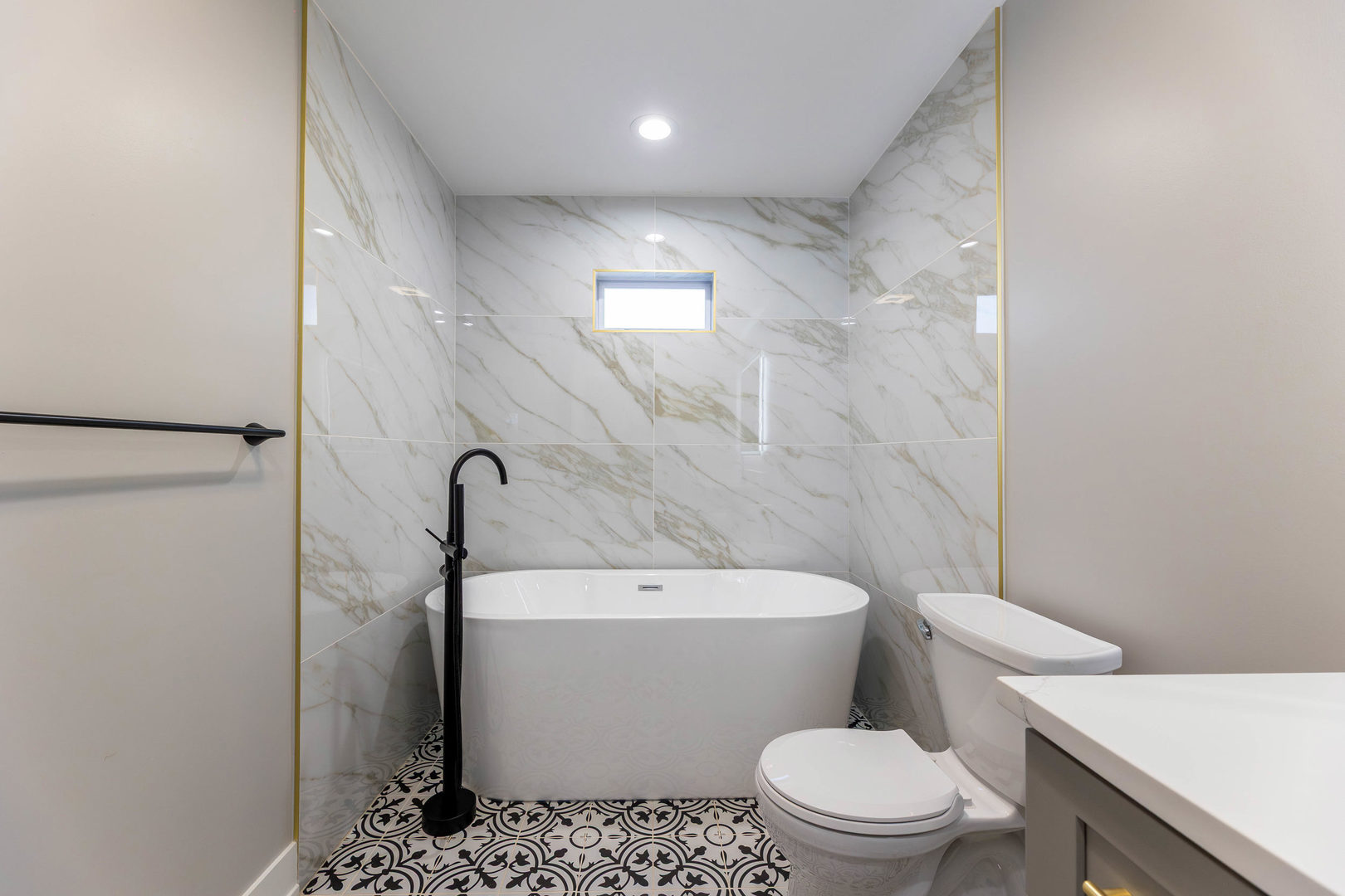 5552 South Shields Avenue Chicago, IL 60621 - Photo 12 of 33 a white toilet sitting next to a bathroom sink and vanity