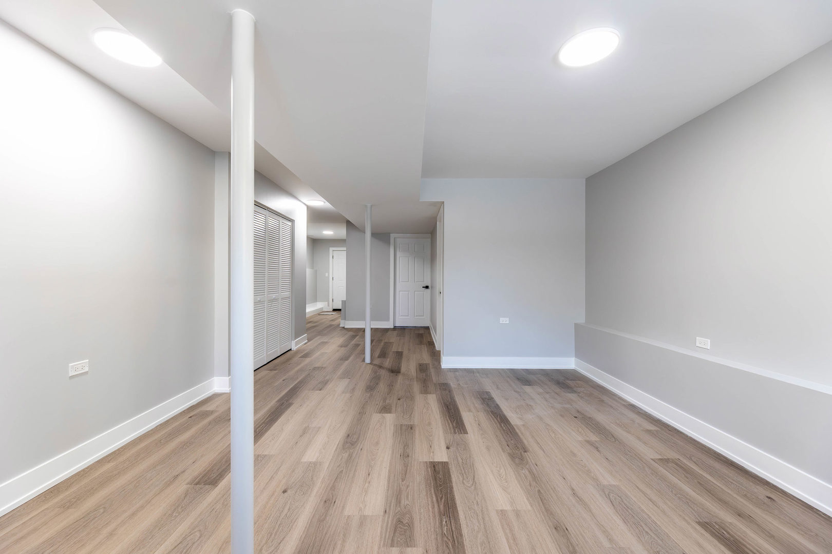 5552 South Shields Avenue Chicago, IL 60621 - Photo 23 of 33 a view of a big room with wooden floor and windows