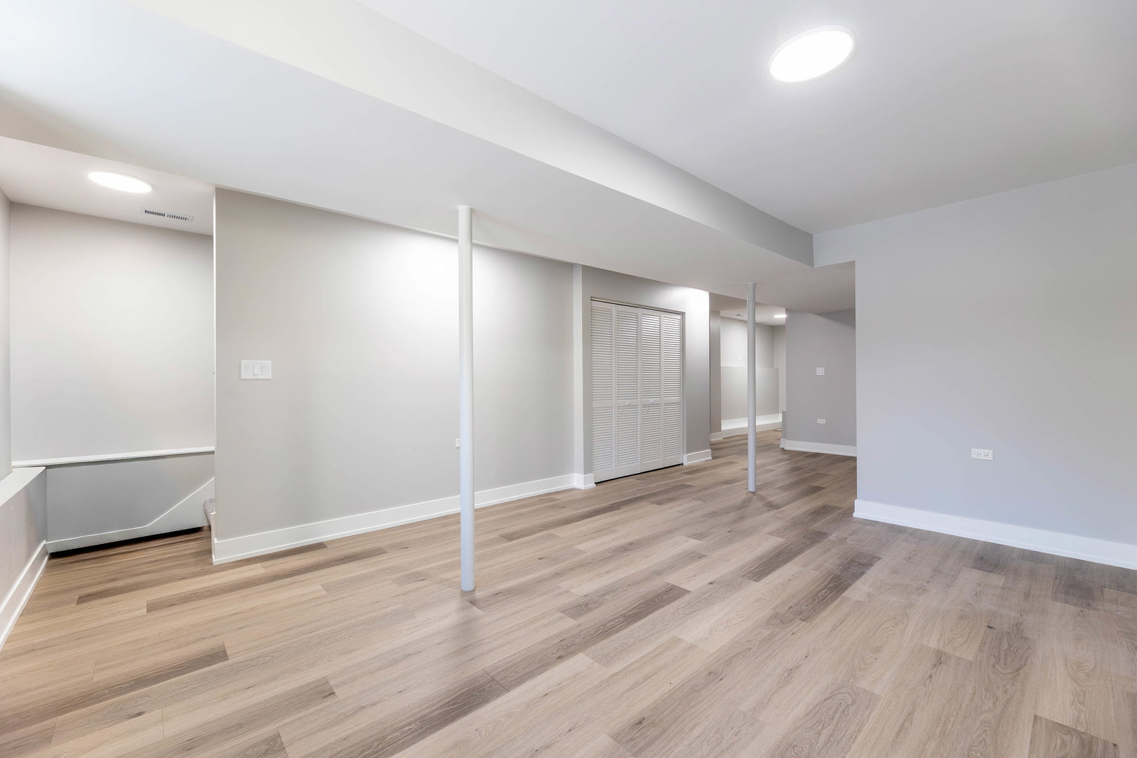 5552 South Shields Avenue Chicago, IL 60621 - Photo 24 of 33 a view of an empty room with wooden floor and a window