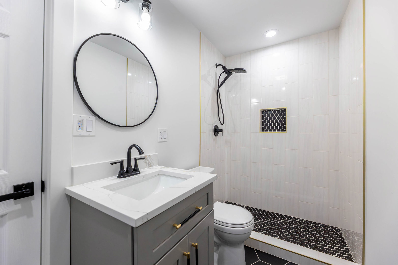 5552 South Shields Avenue Chicago, IL 60621 - Photo 28 of 33 a bathroom with a sink toilet and a mirror