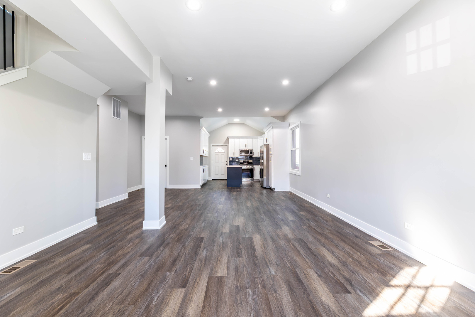 5552 South Shields Avenue Chicago, IL 60621 - Photo 4 of 33 a view of a hallway with wooden floor
