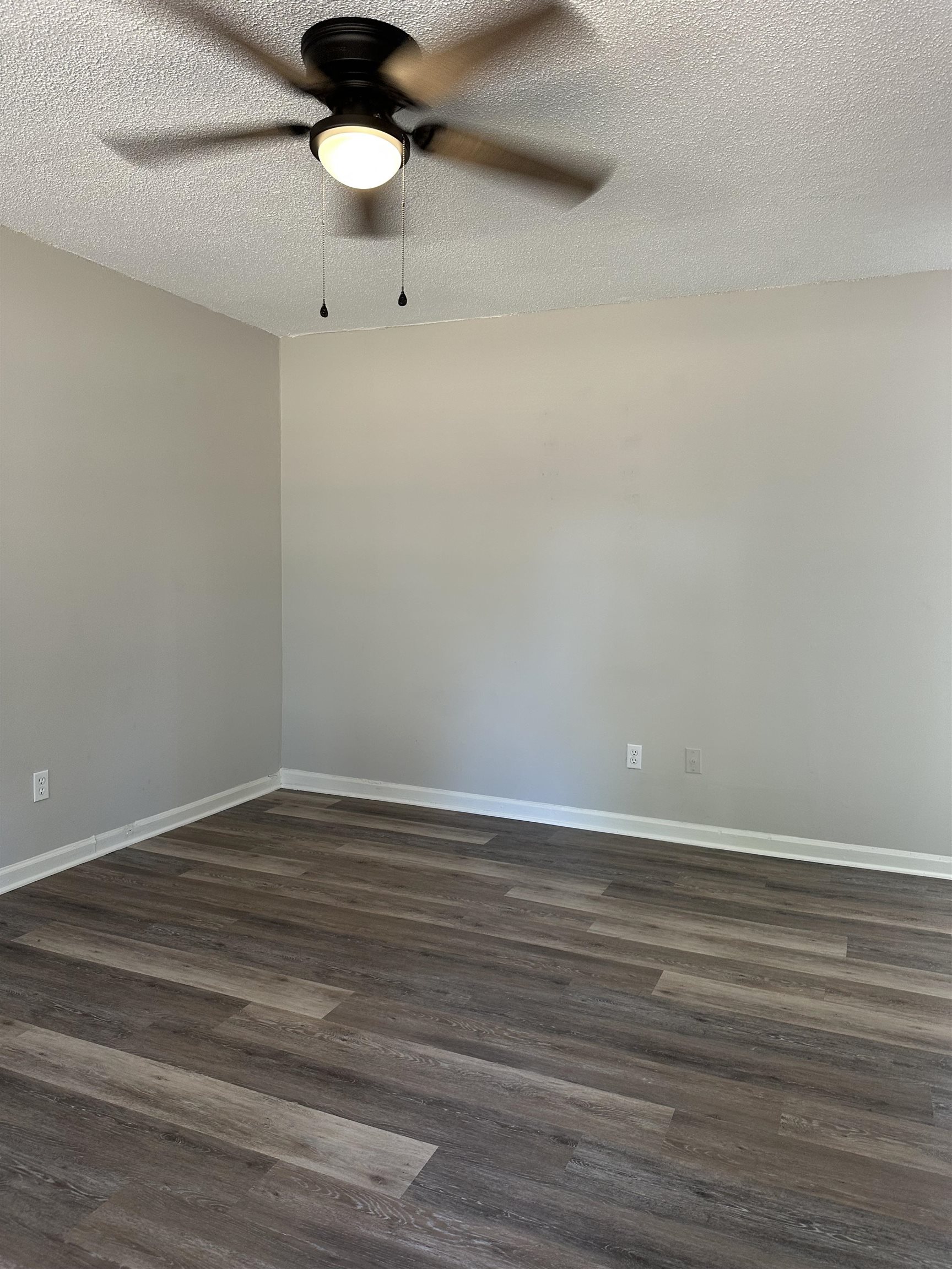 899 West Raines Road Memphis, TN 38109 - Photo 5 of 14 Wood-finish plank flooring with painted walls, ceiling fan with integrated lighting, and white trim