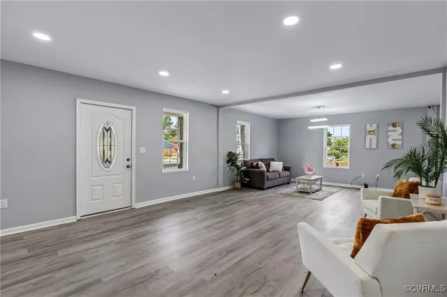 a view of a livingroom with furniture and a workspace