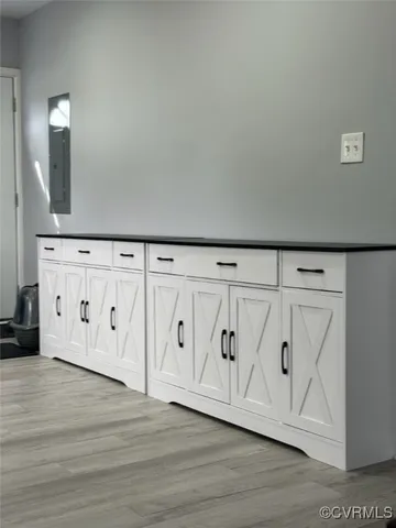 a view of an entryway with wooden floor