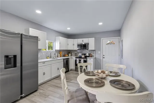 a kitchen with refrigerator and stove