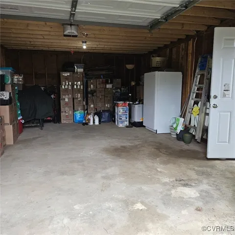 a view of empty room with gym equipment
