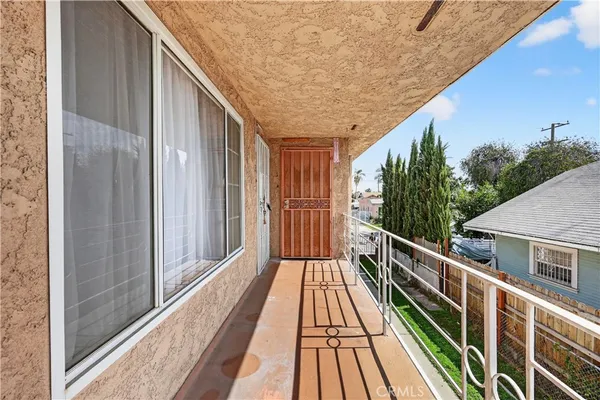 a bedroom with furniture and wooden floor