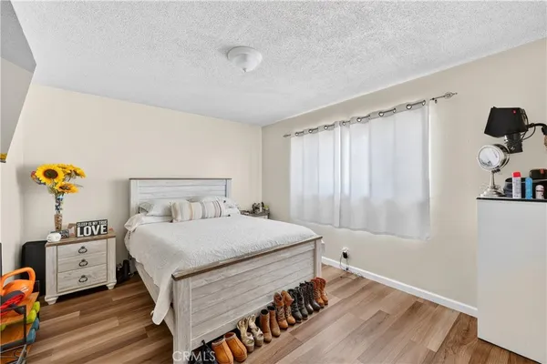 a bedroom with a bed and a television