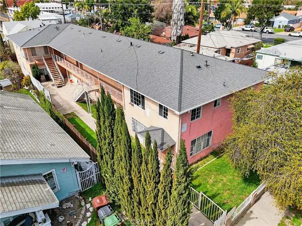 an aerial view of a house with a yard