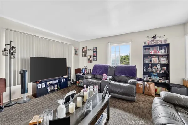 a bed room with a bed and a television