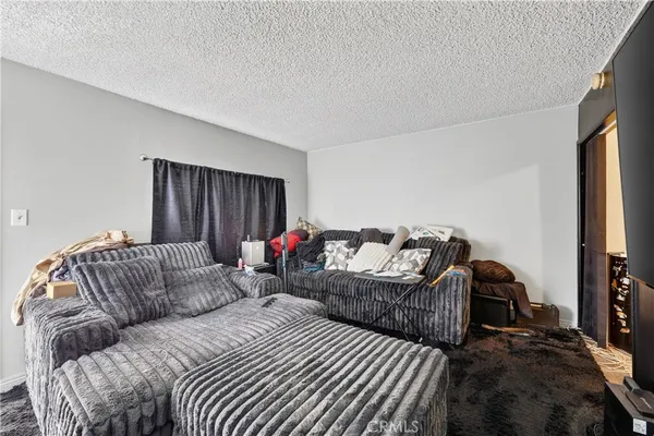a kitchen with granite countertop white cabinets and sink