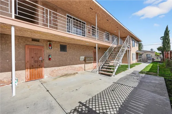 a view of balcony with wooden floor and seating space
