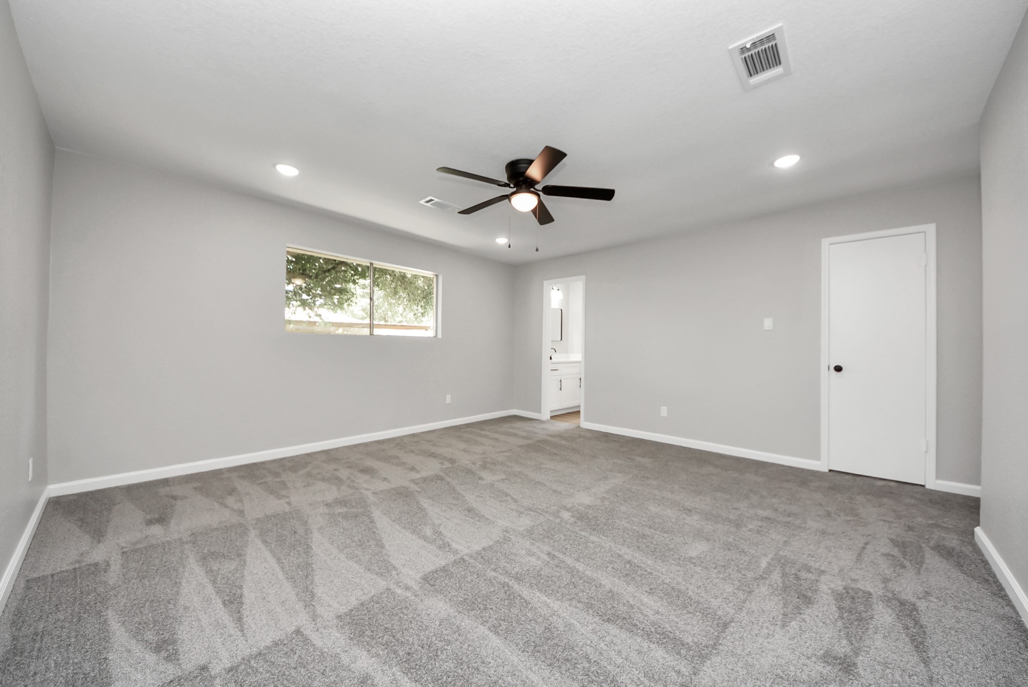 2402 Rolling Glen Drive Spring, TX 77373 - Photo 27 of 38 a view of an empty room with a ceiling fan and window