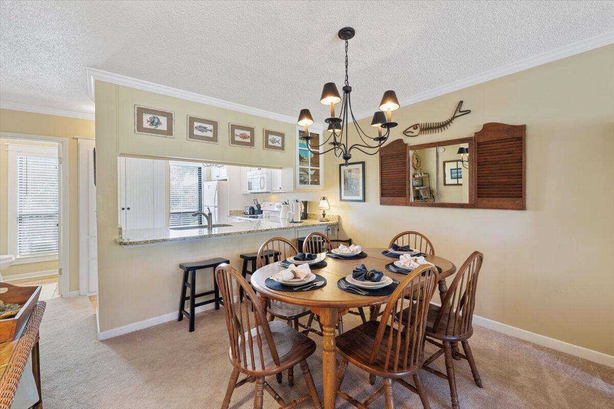 255 Pelican Circle, Unit 3 Inlet Beach, FL 32461 - Photo 13 of 38 a dining room with furniture and window