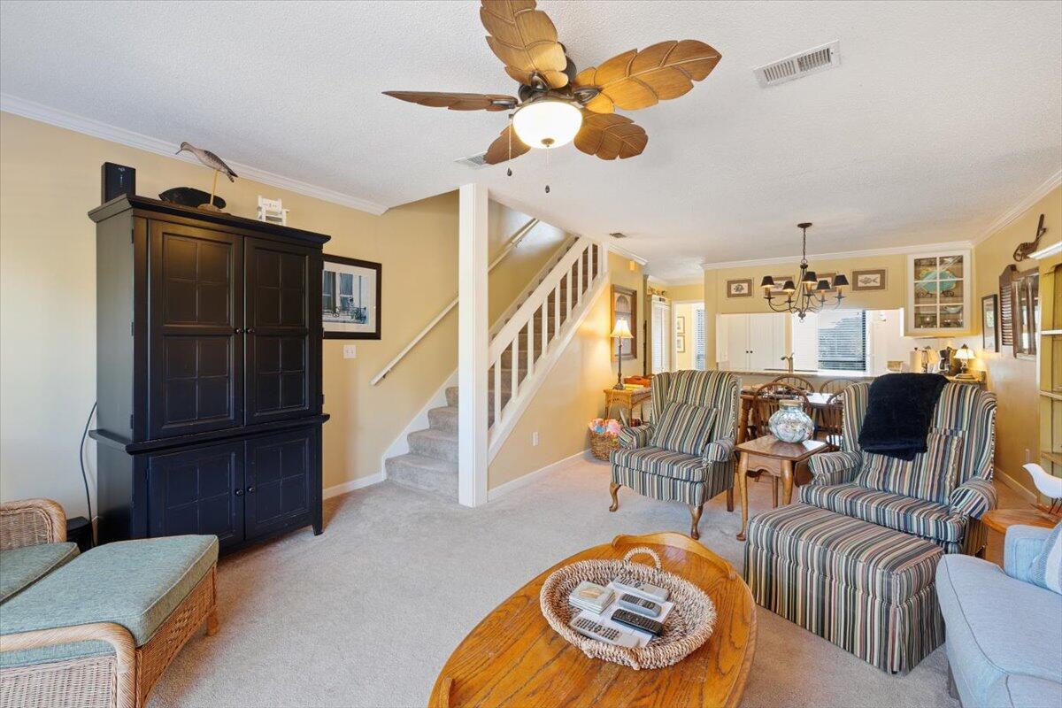 255 Pelican Circle, Unit 3 Inlet Beach, FL 32461 - Photo 18 of 38 a living room with furniture and a chandelier