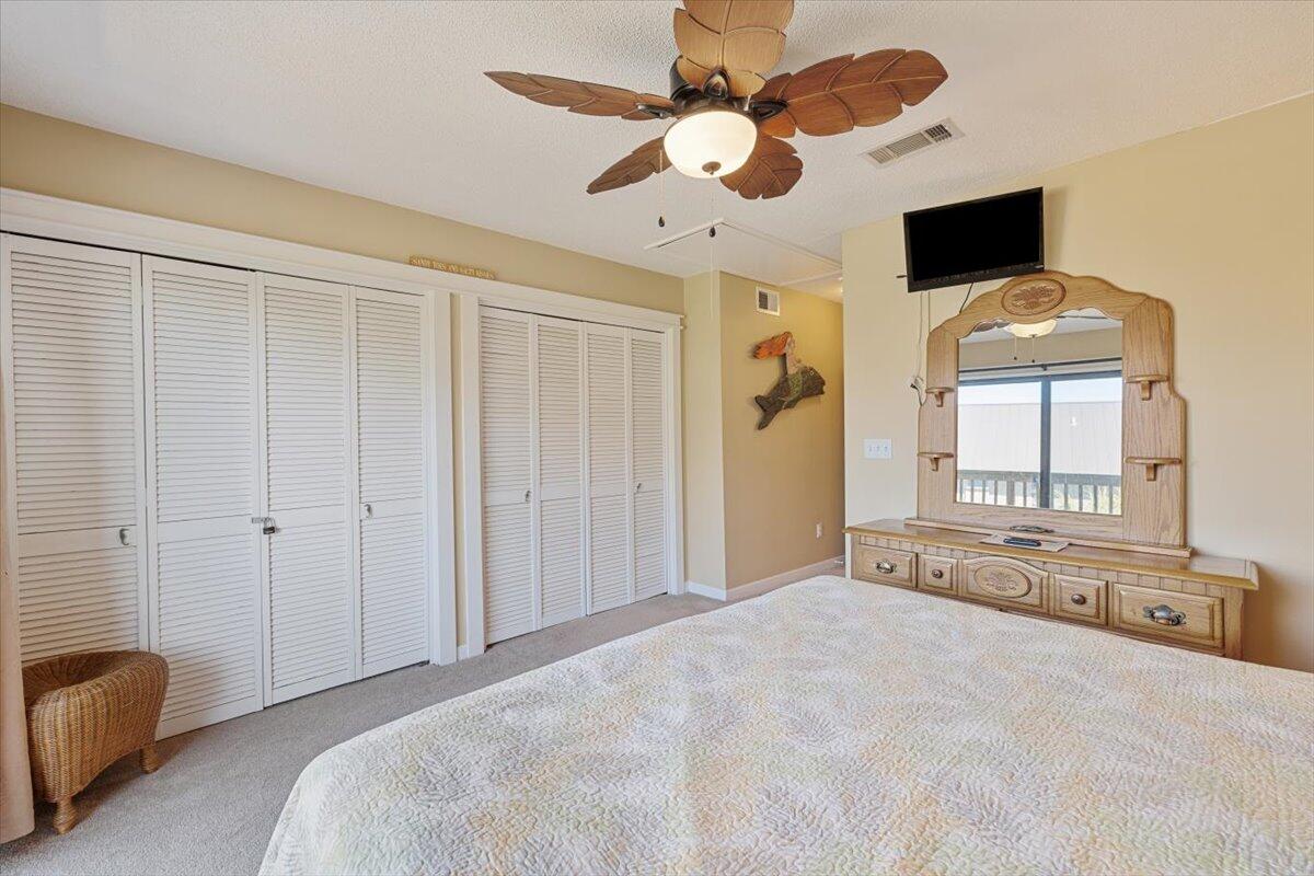 255 Pelican Circle, Unit 3 Inlet Beach, FL 32461 - Photo 25 of 38 a view of an empty room with a flat screen tv