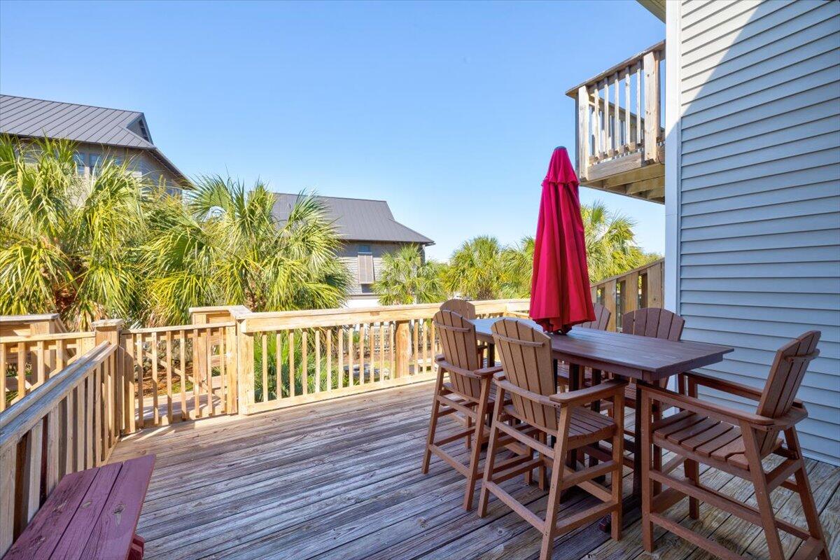 255 Pelican Circle, Unit 3 Inlet Beach, FL 32461 - Photo 27 of 38 a view of a chairs and table in the balcony