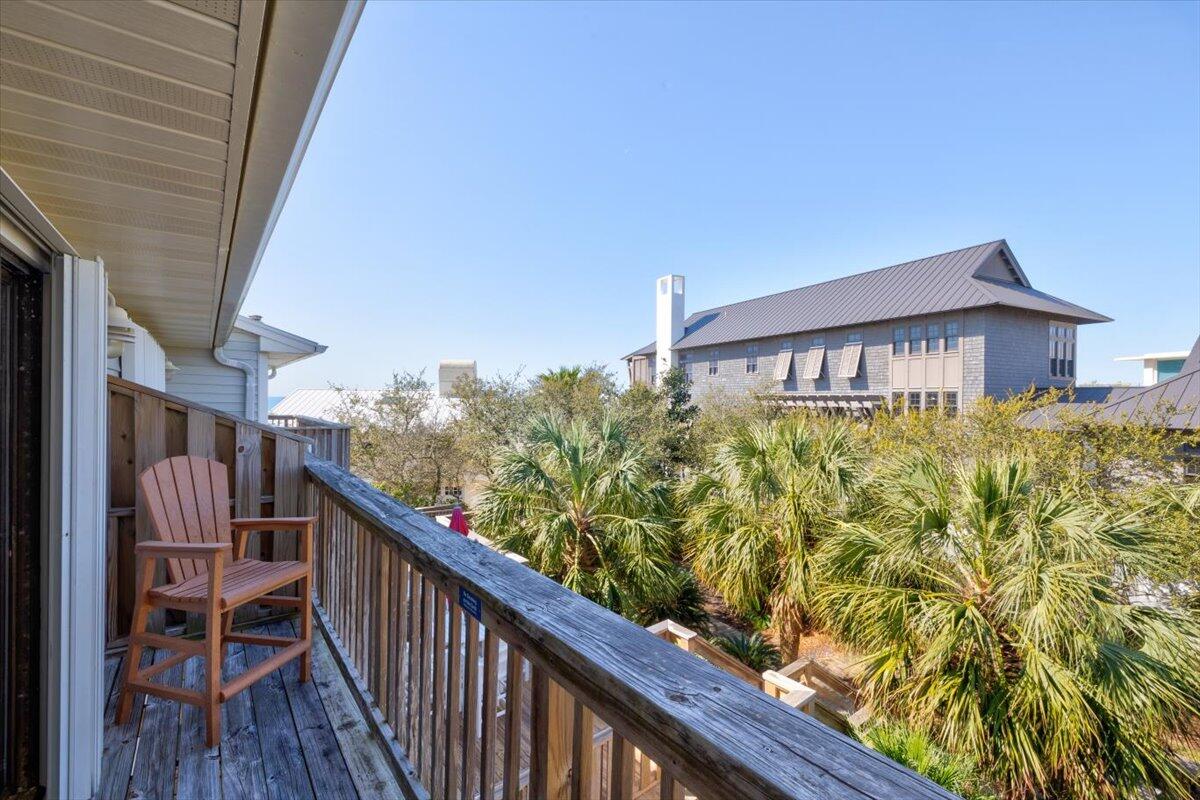 255 Pelican Circle, Unit 3 Inlet Beach, FL 32461 - Photo 29 of 38 a view of a balcony with wooden floor and fence