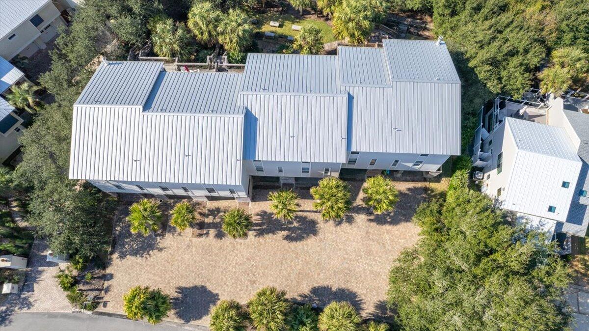 255 Pelican Circle, Unit 3 Inlet Beach, FL 32461 - Photo 34 of 38 a view of a small yard with white house
