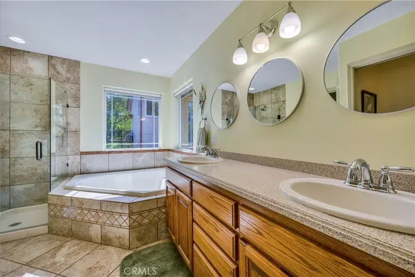a bathroom with a bathtub and a shower