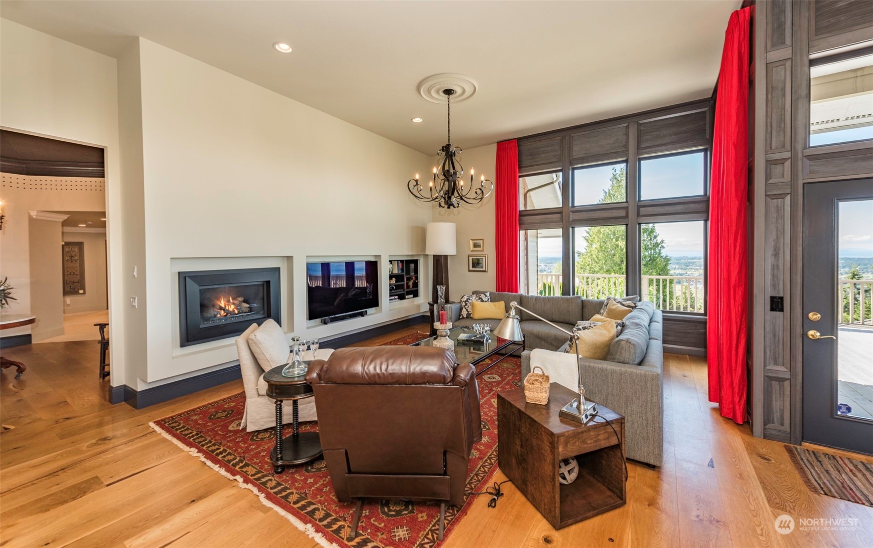 82 Owls Nest Road Sequim, WA 98382 - Photo 13 of 40 a living room with furniture a flat screen tv and a fireplace