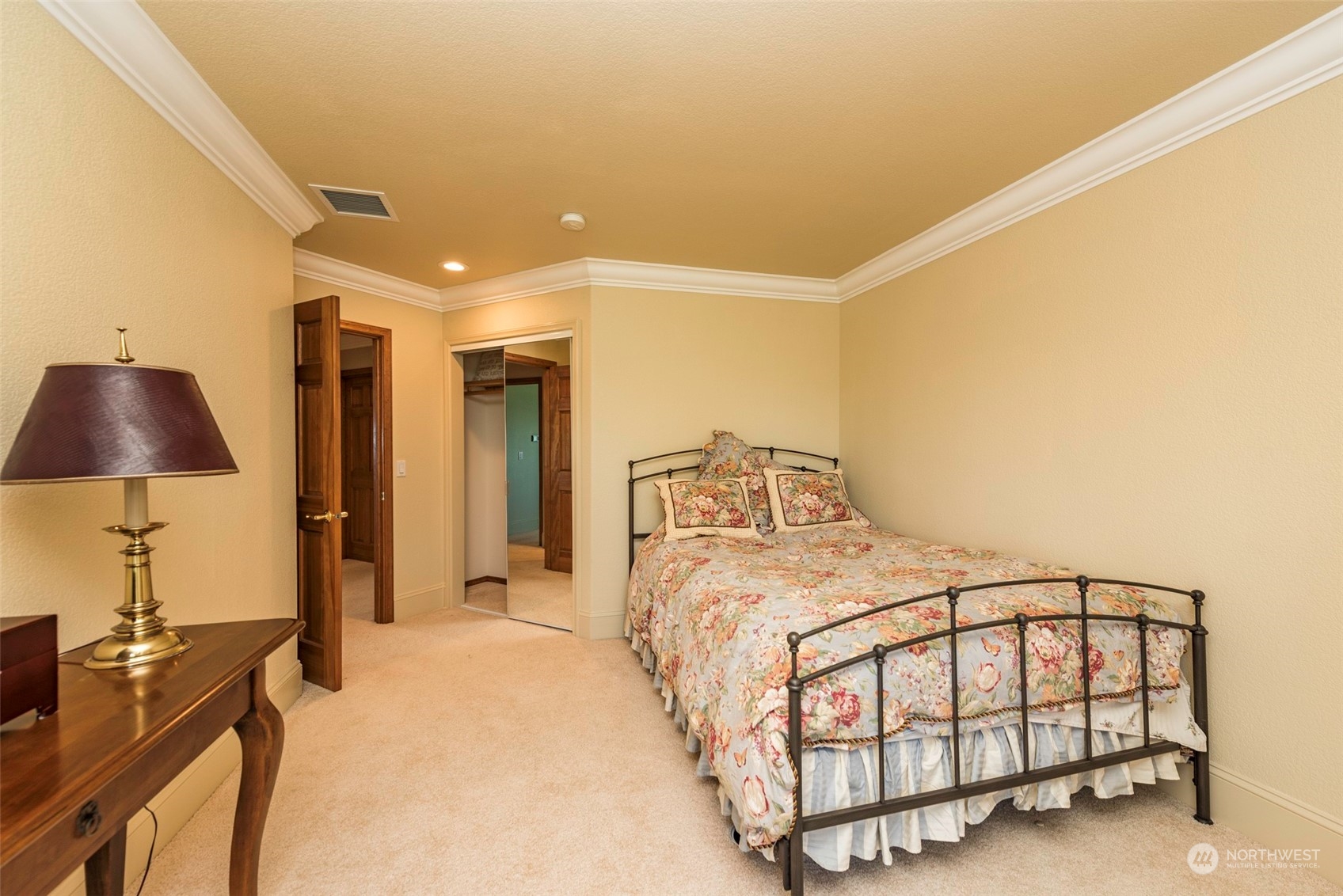 82 Owls Nest Road Sequim, WA 98382 - Photo 23 of 40 a bedroom with a bed and a lamp on the table