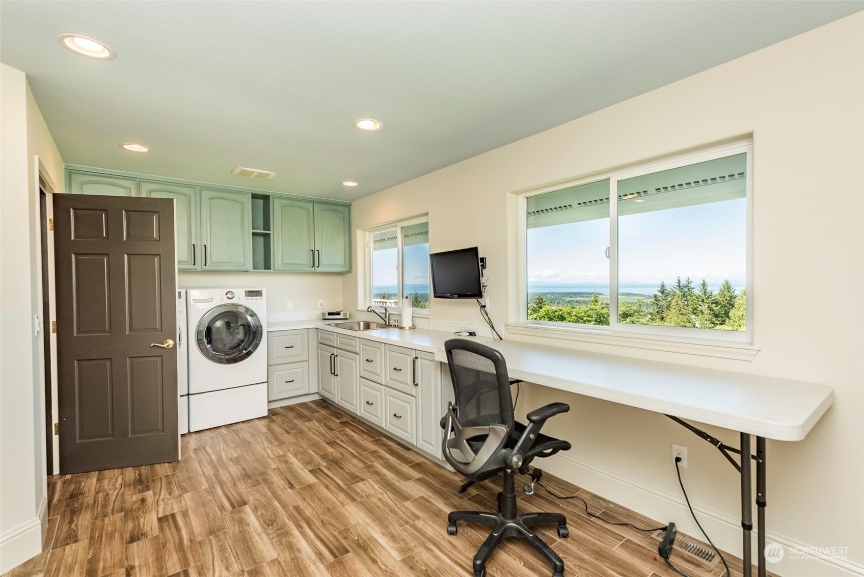 82 Owls Nest Road Sequim, WA 98382 - Photo 27 of 40 a view of a workspace with furniture and a gate